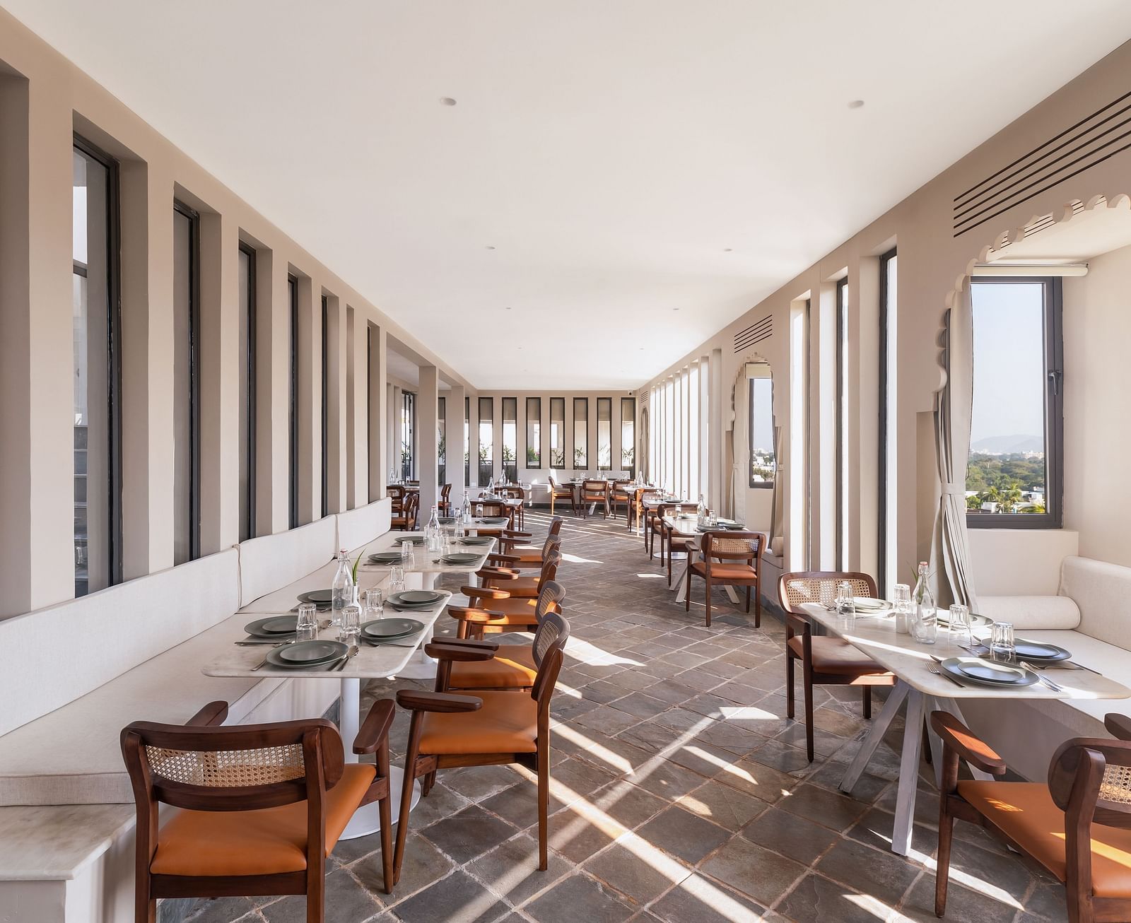 Seating arrangements inside a restaurant at Manuscript - Jhilwara Haveli, Udaipur
