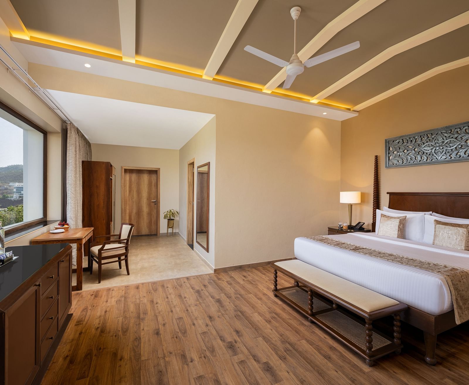 Executive Suite Room with double beds placed in front of TV at Essentia Luxury Resort & Spa, Udaipur.