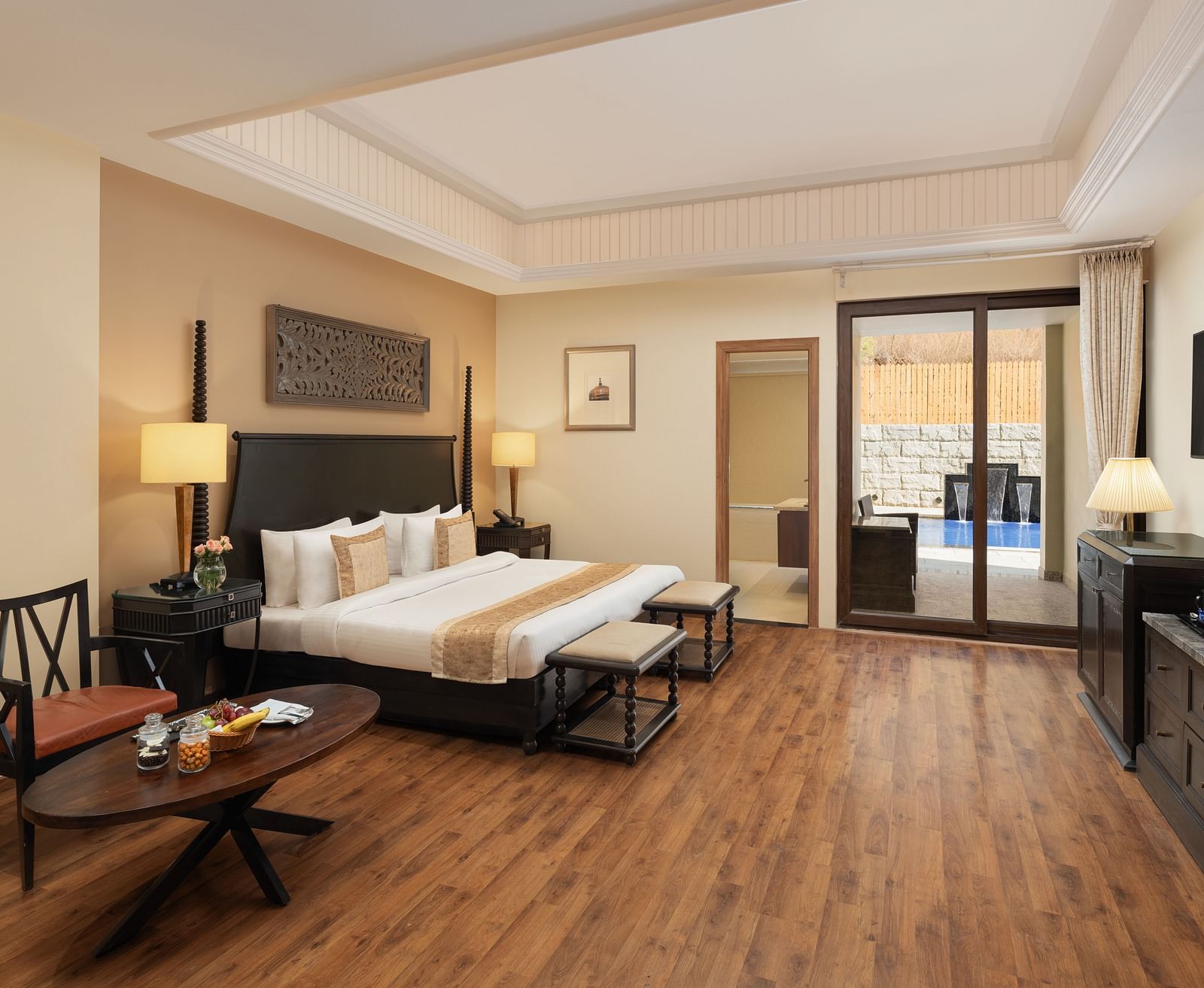 Presidential Suite Room with double beds placed in front of TV at Essentia Luxury Resort & Spa, Udaipur.