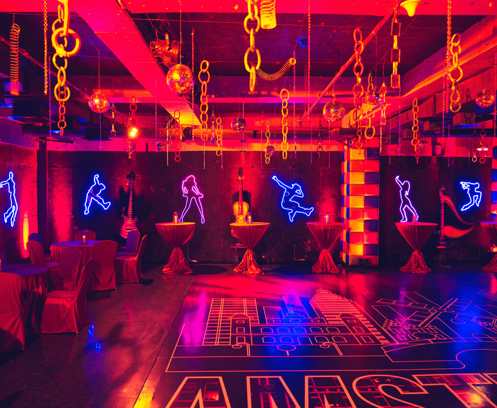 Vibrant dance or fitness studio with neon lights and suspended equipment at Narayani Heights Hotel & Resorts, Ahmedabad.