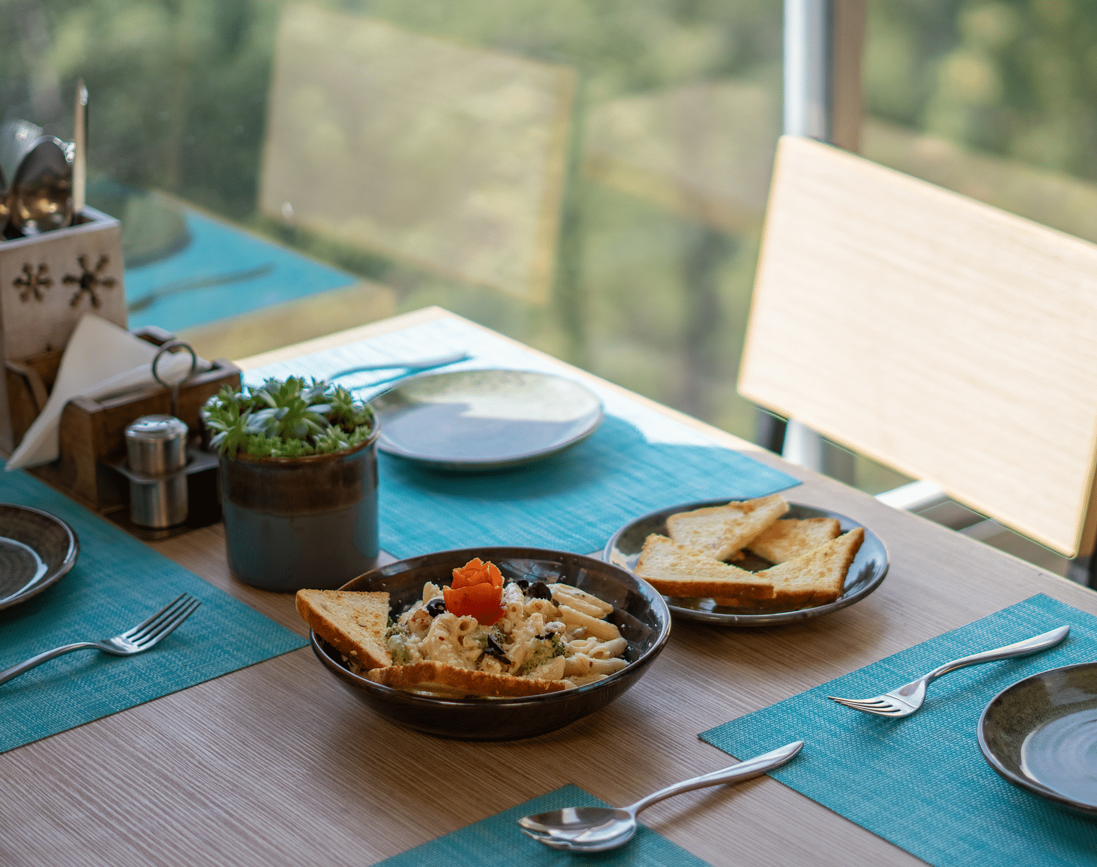 A dish placed on a table with cutlery arranged beside it at BluSalzz Escapade Resort, Lansdowne