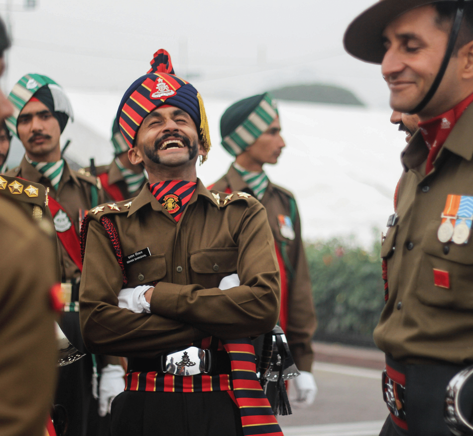 image of a several indian army officers laughing 