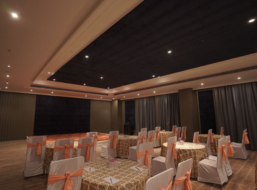banquet hall with chairs and tables at Classic Sapphire by Ananta