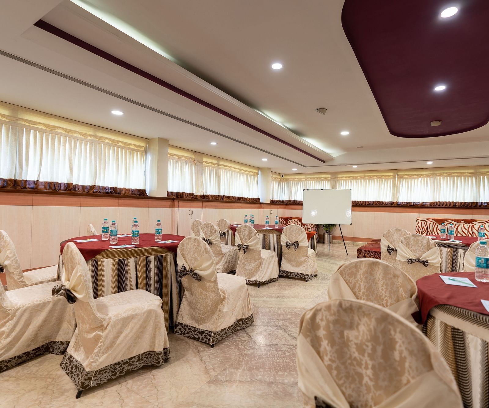 Seating arrangements inside the banquet hall - Hotel Pai Comforts, JP Nagar