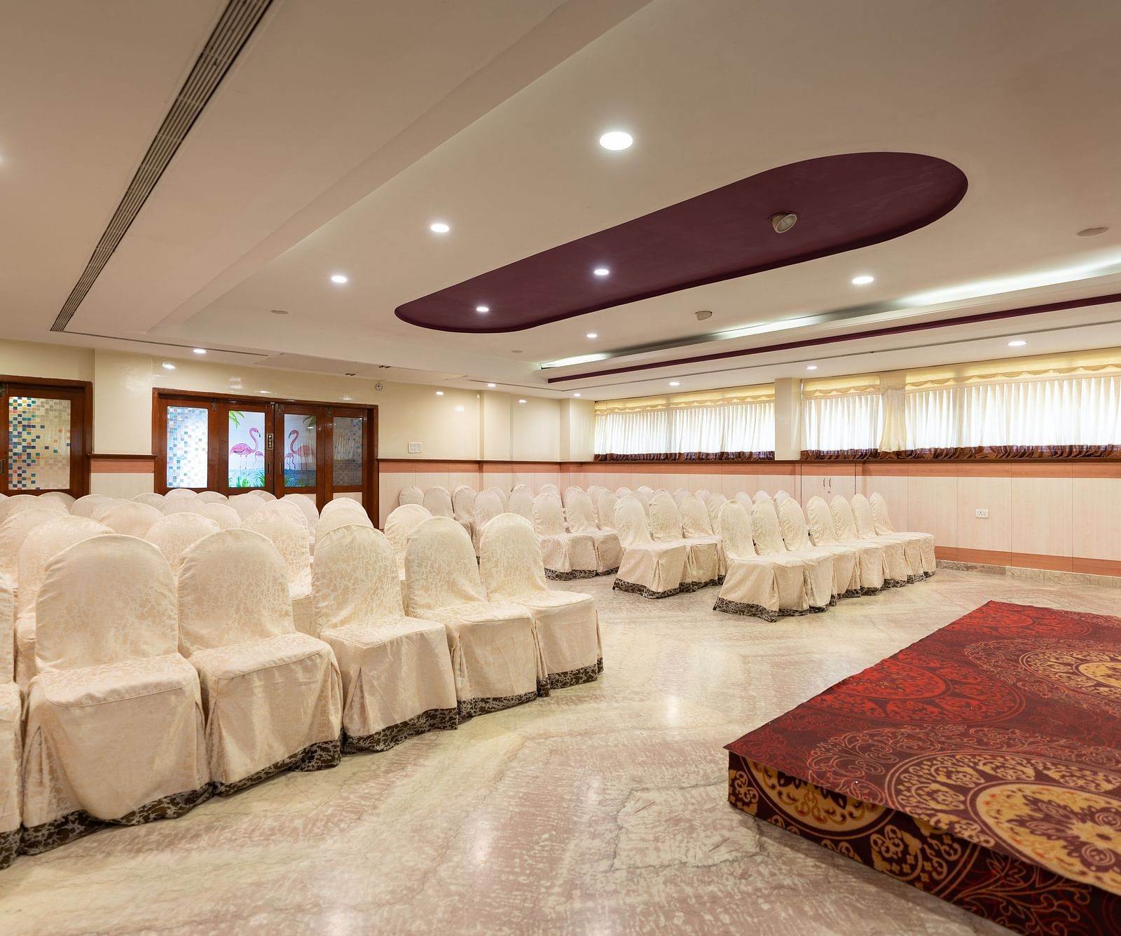 Seating arrangements inside the banquet hall - Hotel Pai Comforts, JP Nagar