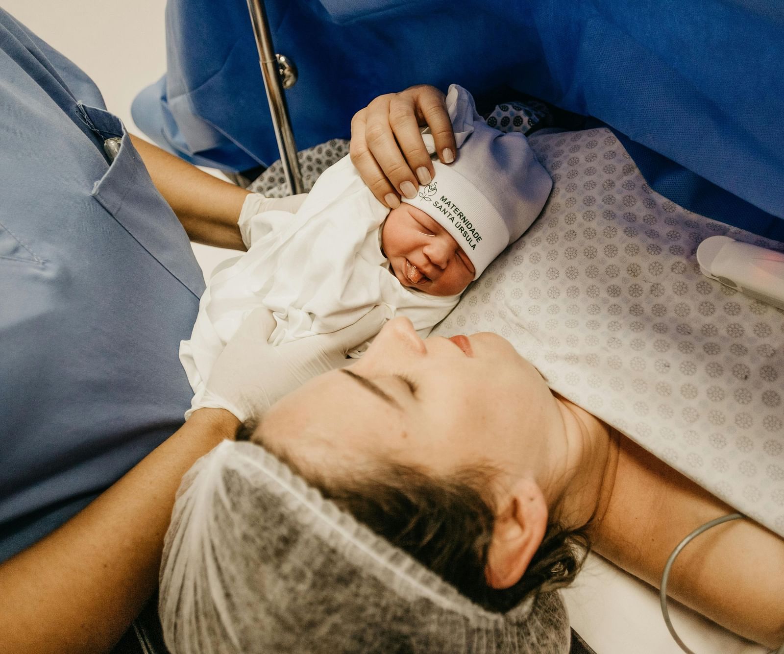 An image of a mother holding her new born 