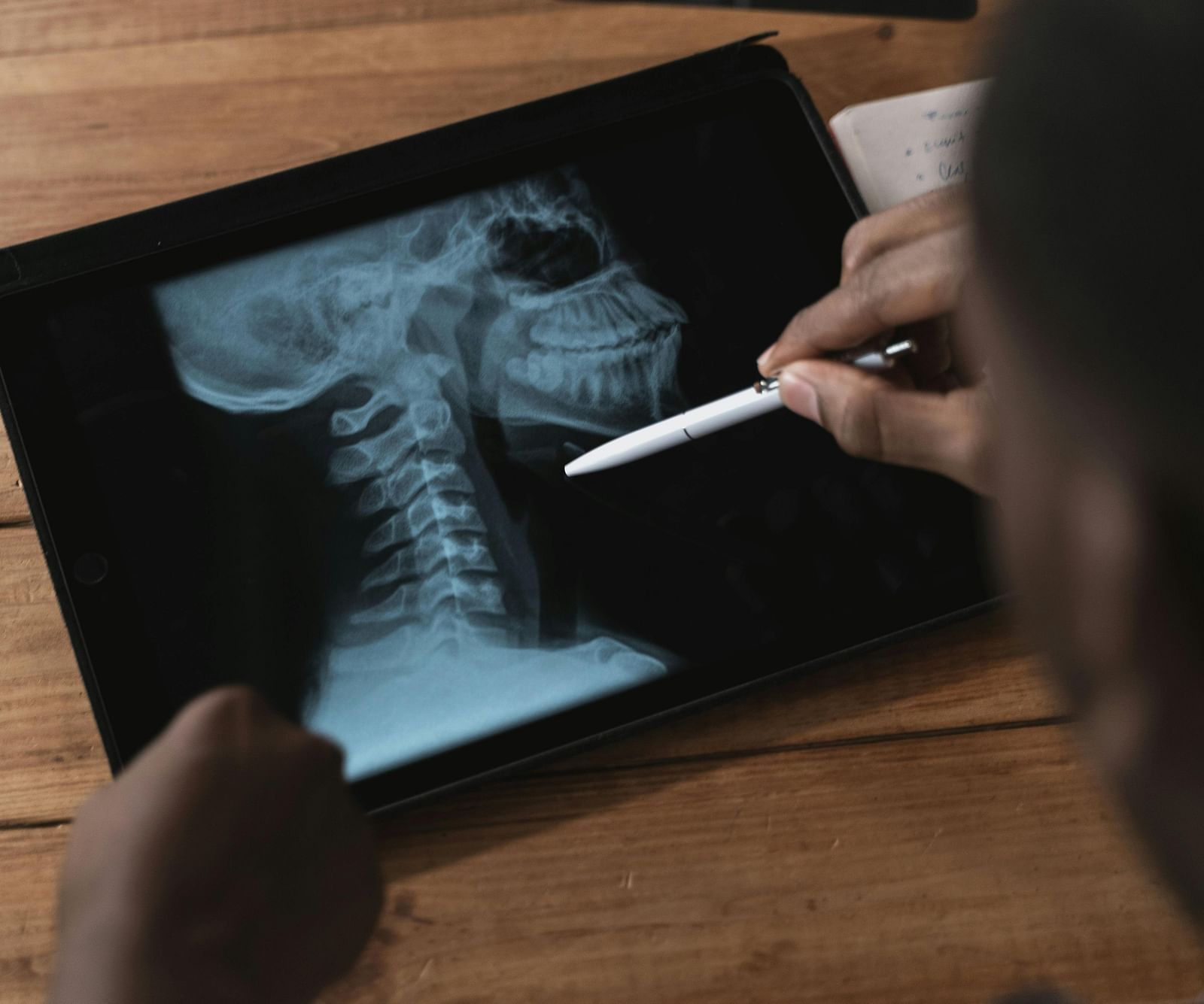An image of a  doctor examining facial bones using modern technology