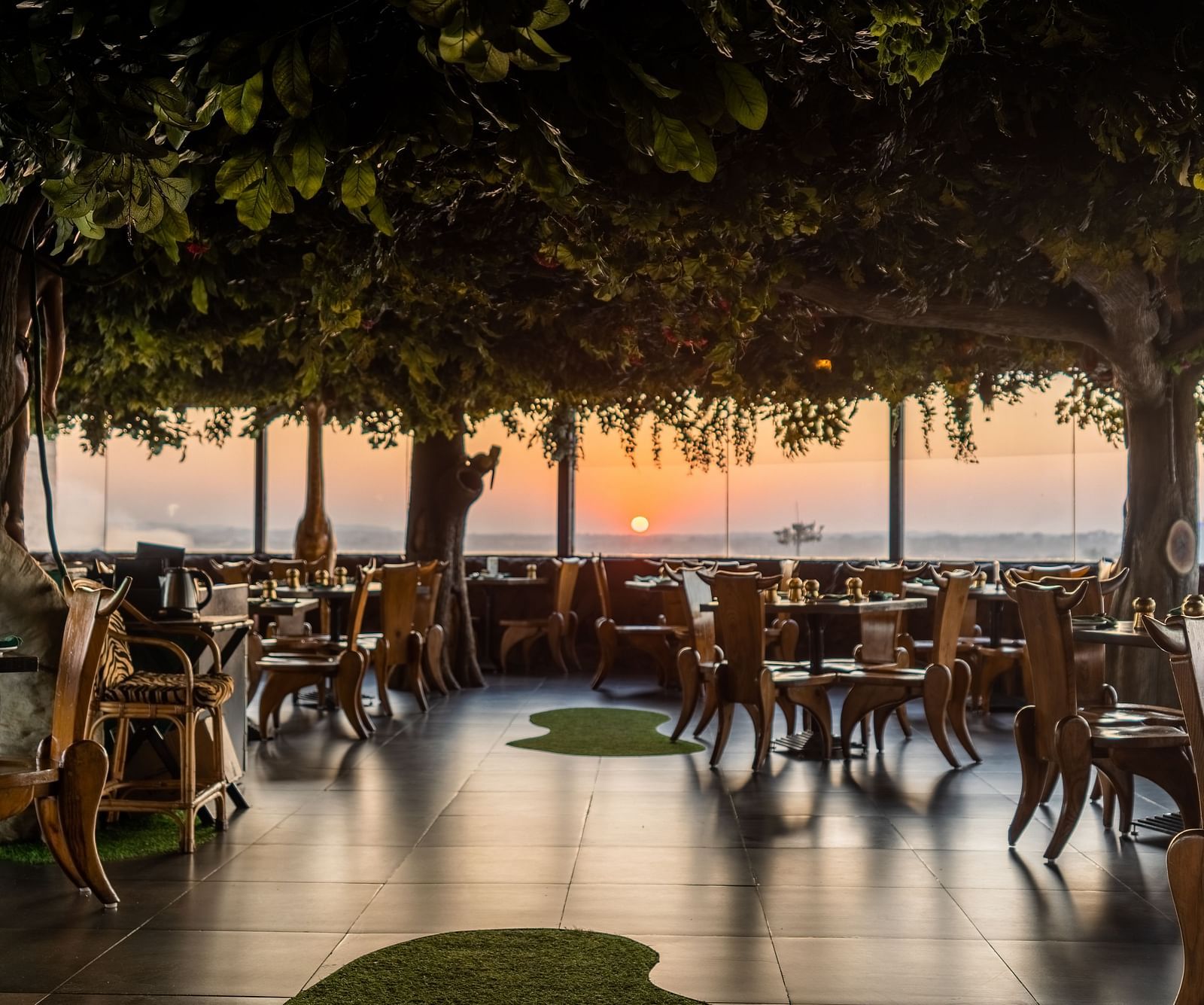An image of a forest themed Jungle Restaurant at The President Hotel, Hubli
