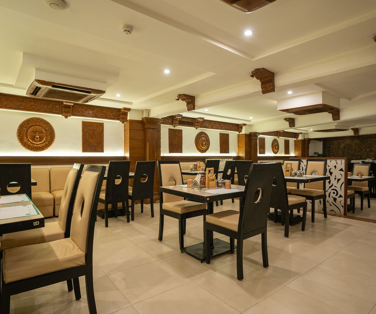 A  an image of the seating arrangement at the Andhra Ruchulu restuarant in The President Hotel, Hubli