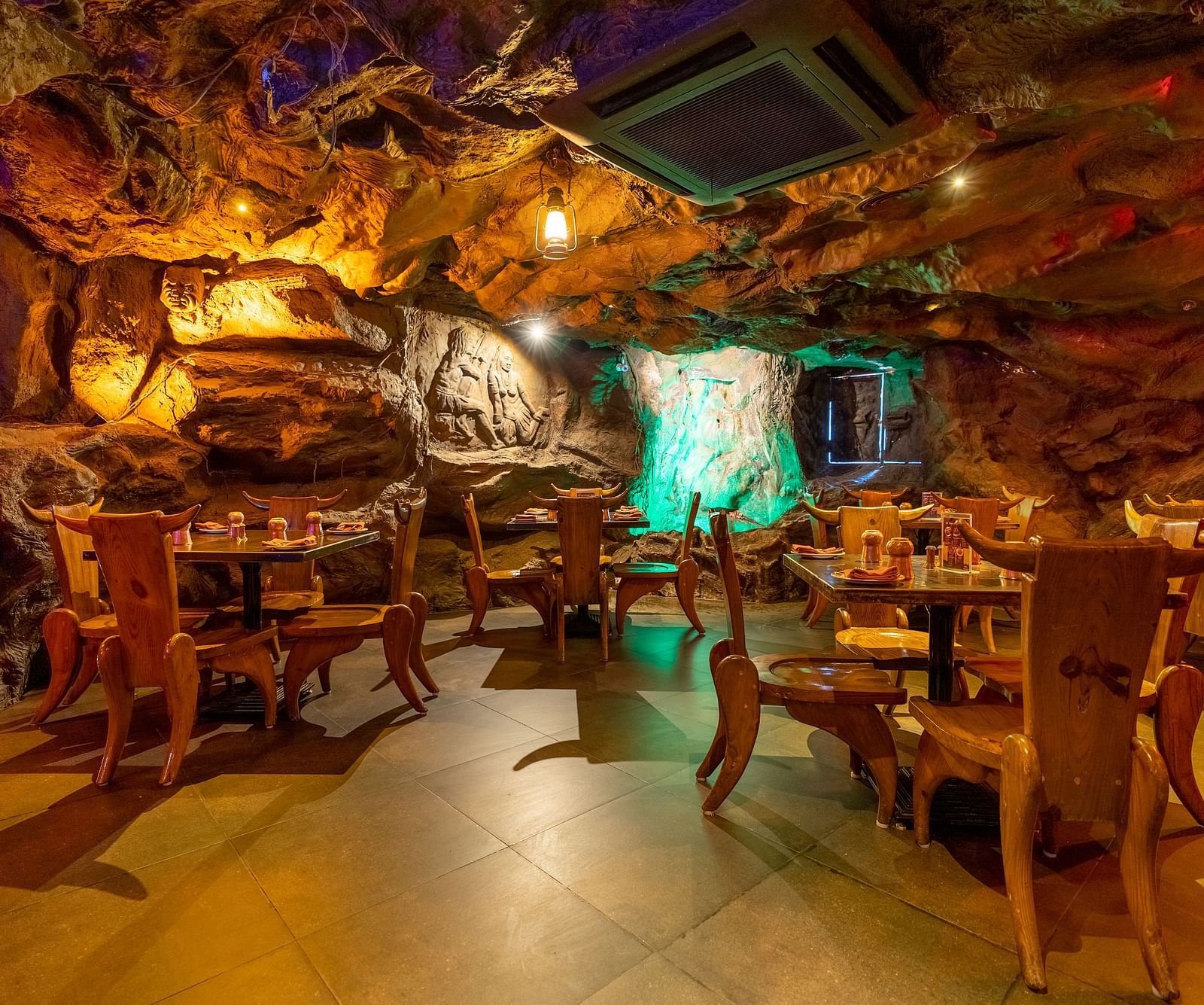 Seating arrangements inside the cave themed gufha restaurant at The President Hotel