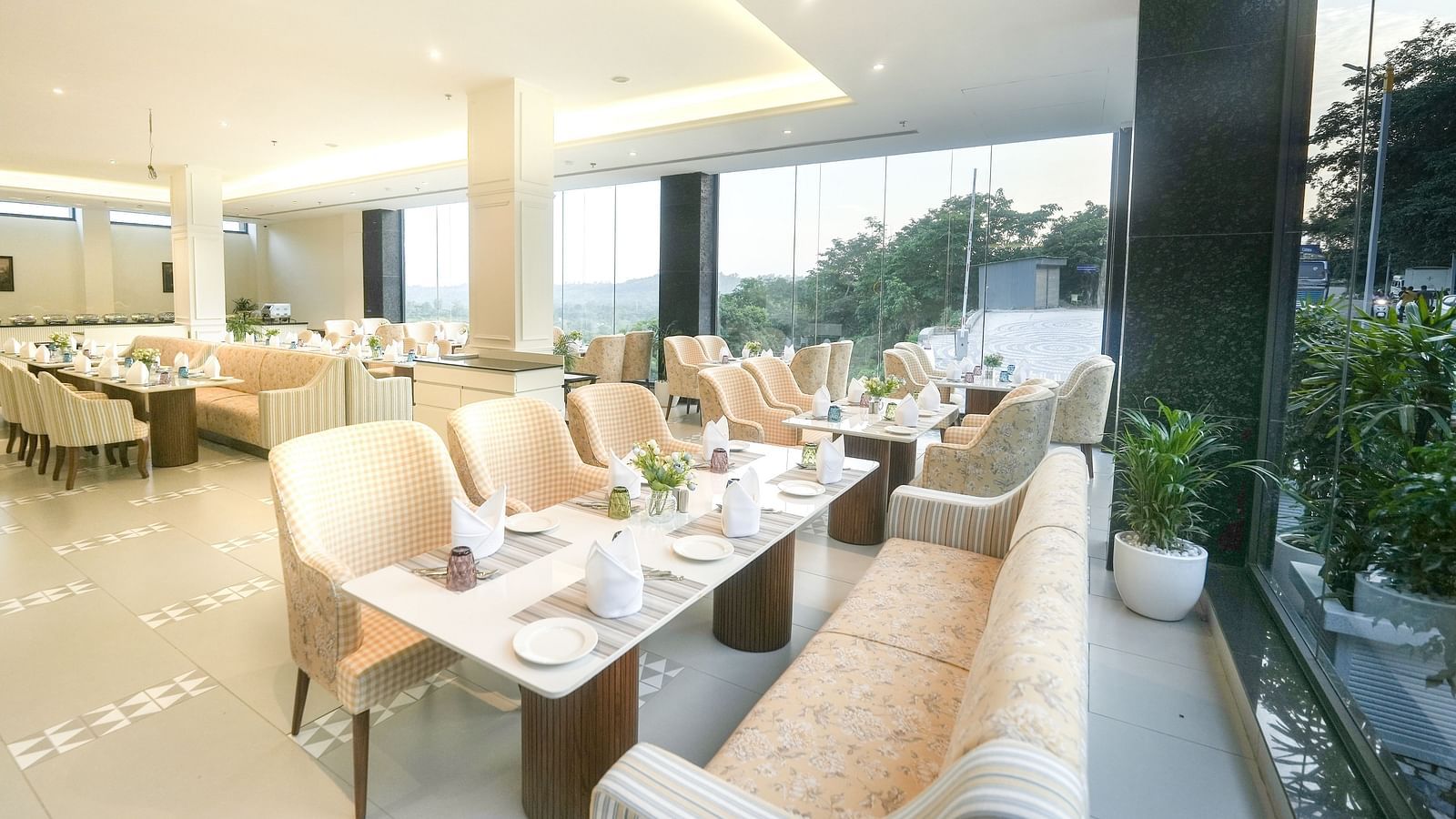 An image of a restaurant with tiled flooring, cosy furniture, and dining tables near a floor-to-ceiling window - NAMAMI BY ZENQ BANKHANDI