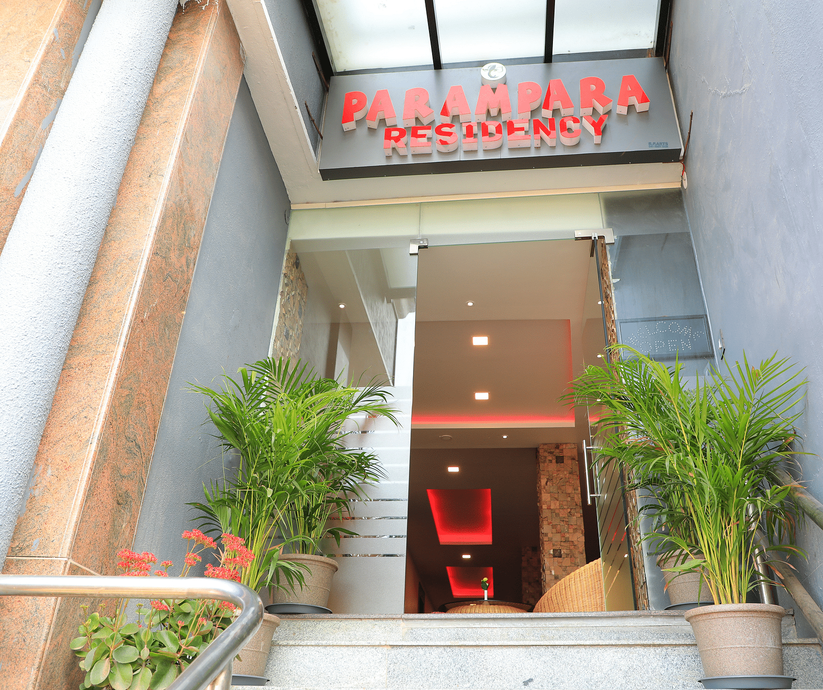 Facade of Parampara Residency, Kushalnagar Town with Parampara Residency written above the entrance.