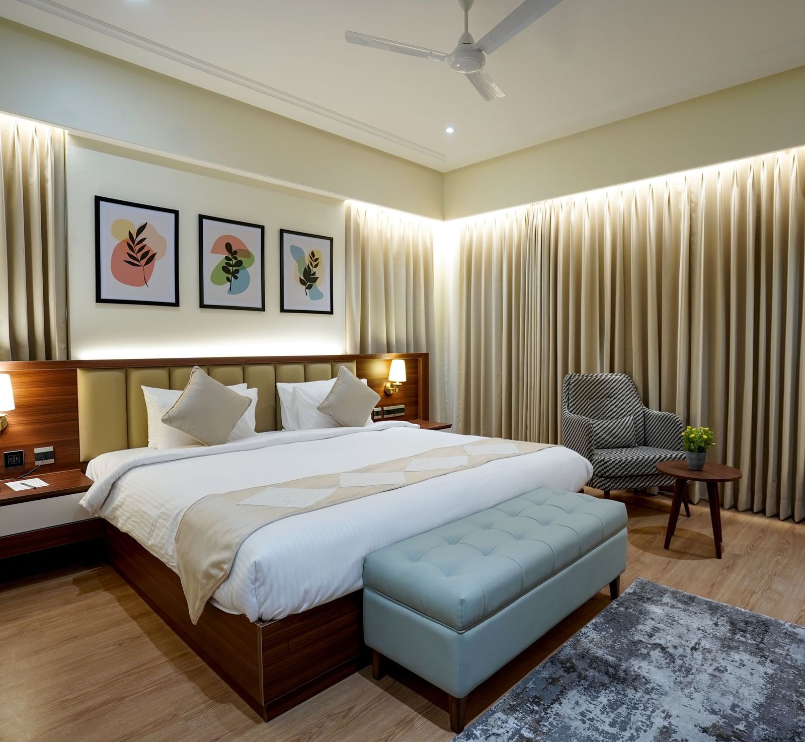 Full view of the Superior King Bed Room featuring a king size bed along with a cushioned bench in placed in front of it at M2 Square by Monday Premium.