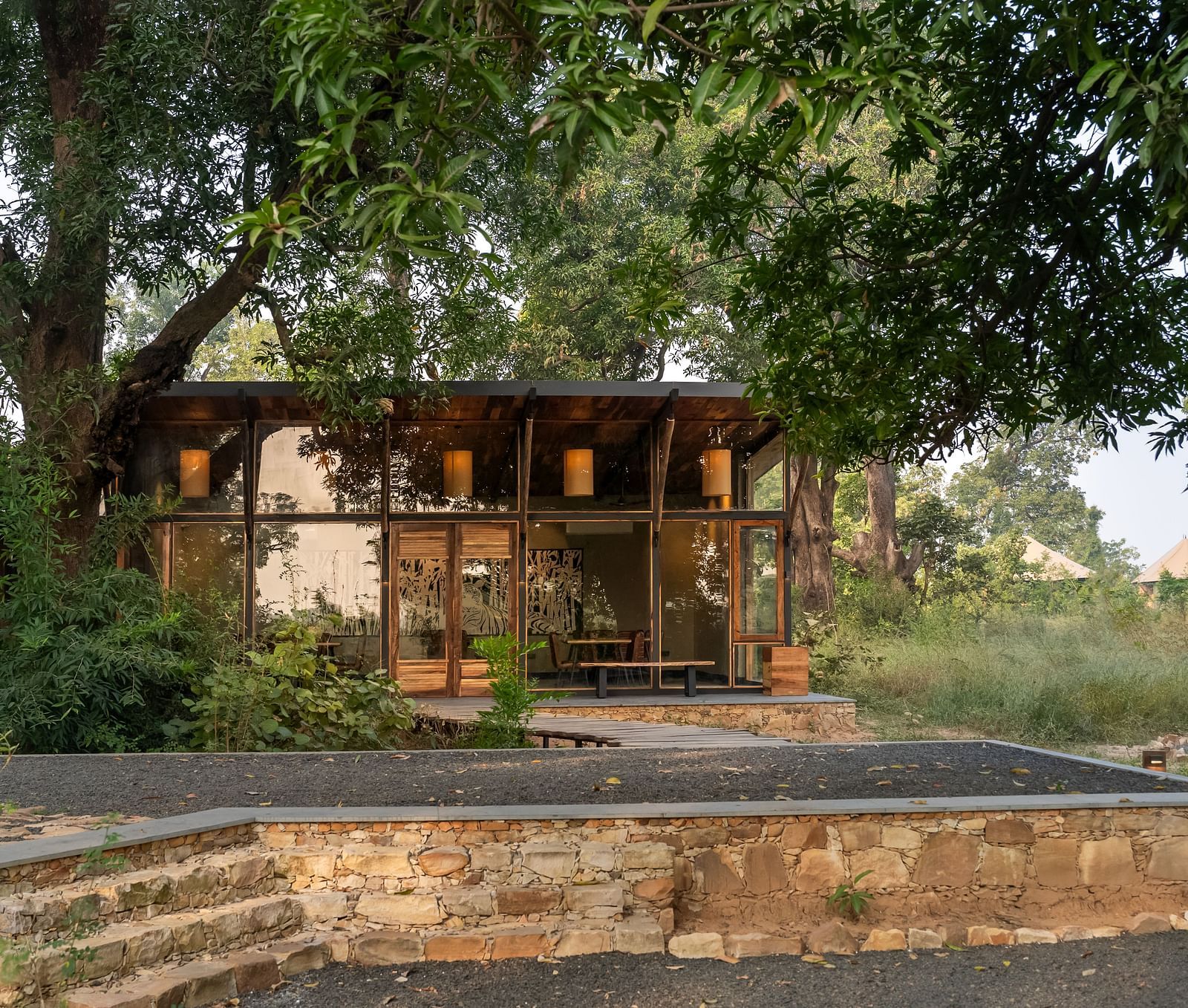 View of a hut amongst greenery at Trees N Tigers, Tadoba.