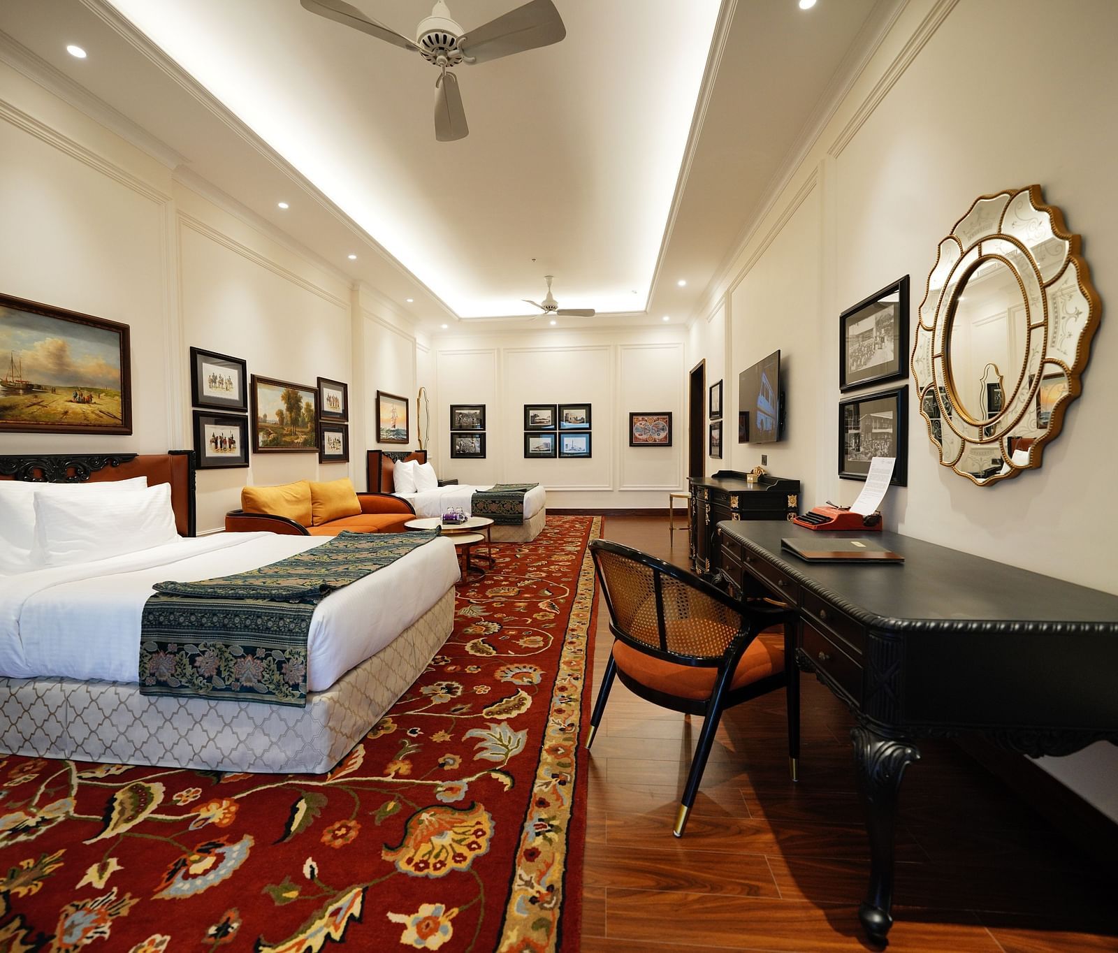 twin beds and walls are decorated with paintings - Mayfair Tea Resort, Siliguri 2