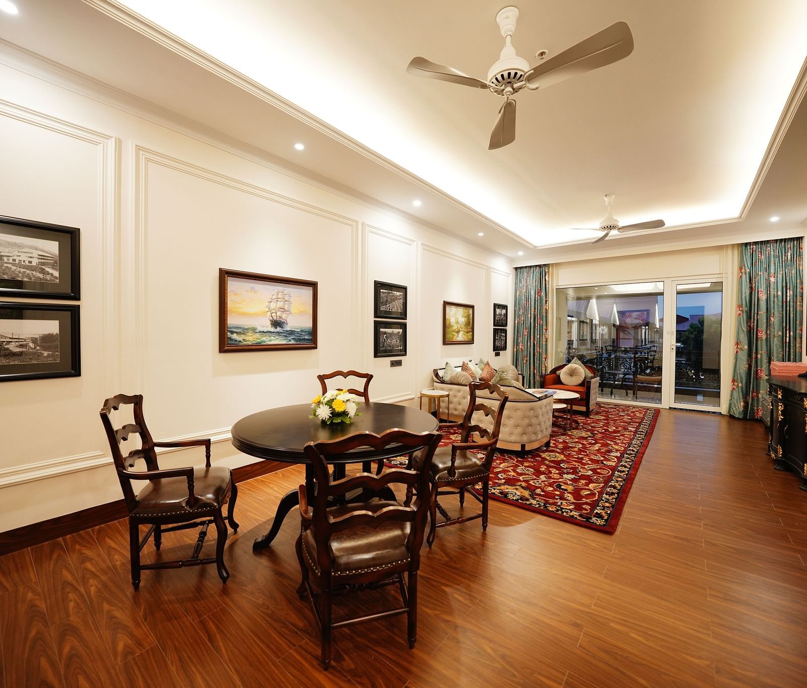 chairs and a sofa set facing a TV in the living room - Mayfair Tea Resort, Siliguri 