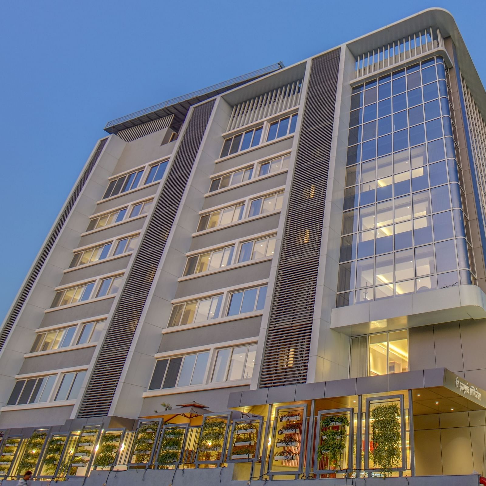 Low angle shot of Facade of  The SSK Solitaire Boutique Hotel & Spa, Gangapur Road - Nashik with backdrop of blue sky