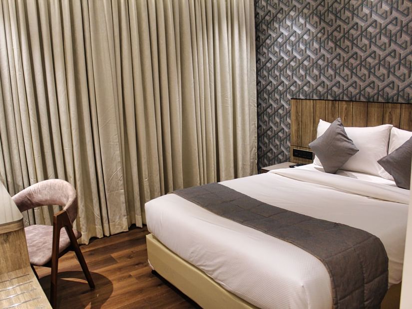Side view of hotel room with double bed at Maxxvalue Hotel MIDC,  Mumbai