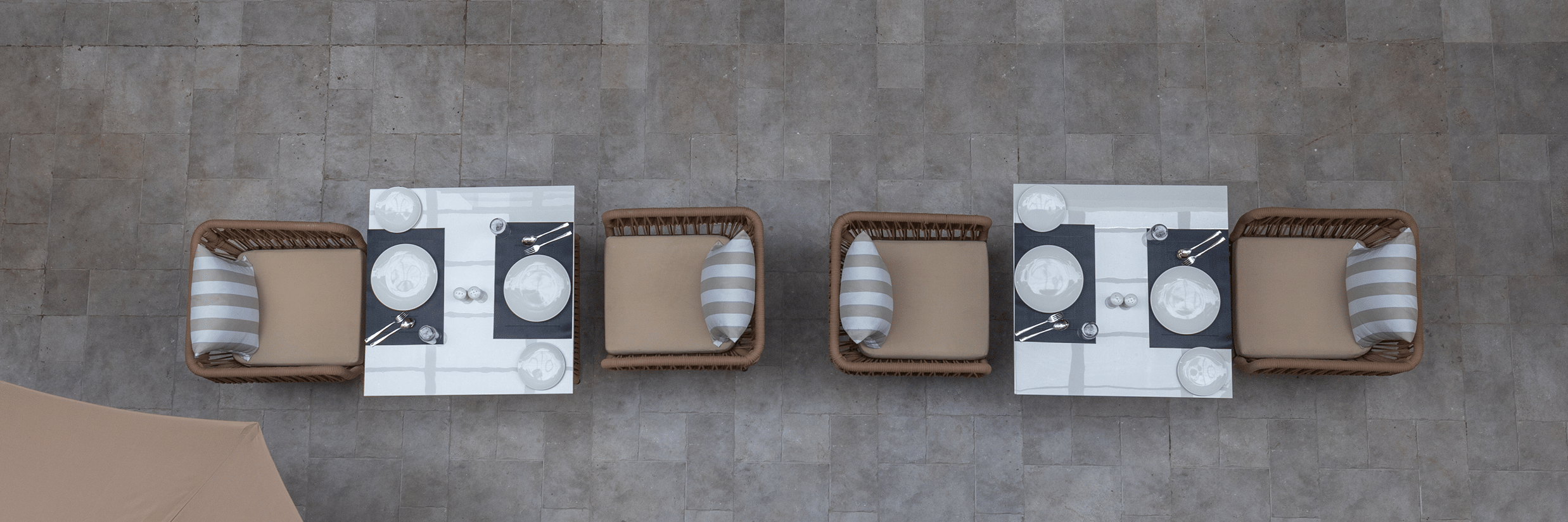 Top-down aerial view of the open-air courtyard dining tables and seating at Sibaya Courtyard By Stone Wood Premier.