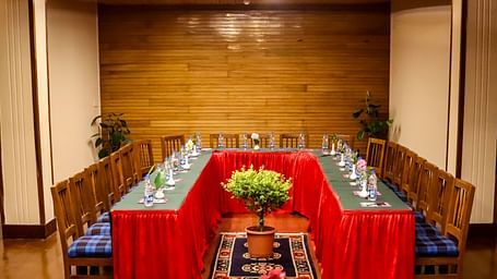 U-shaped conference arrangement in a well-lit meeting hall, perfect for workshops and corporate sessions - cedar inn