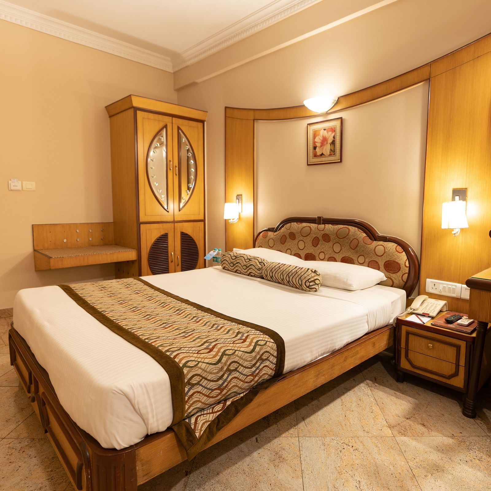 The Executive Room at Hotel Pai Viceroy Jayanagar featuring a queen sized bed, dressing table amongst other amenities
