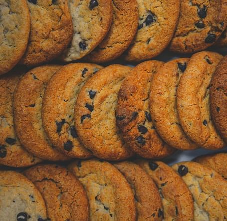 A tempting stack of golden chocolate chip cookies