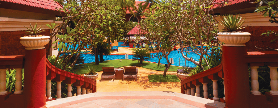 entrance to Caravela Beach Resort Goa with the swimming pool in the background