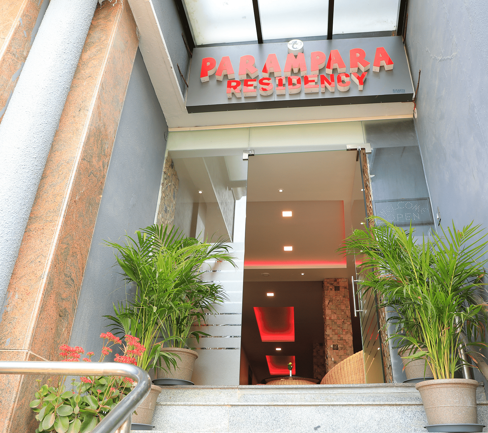 Entrance of Parampara Residency, Kushalnagar with Parampara Residency written above the door.