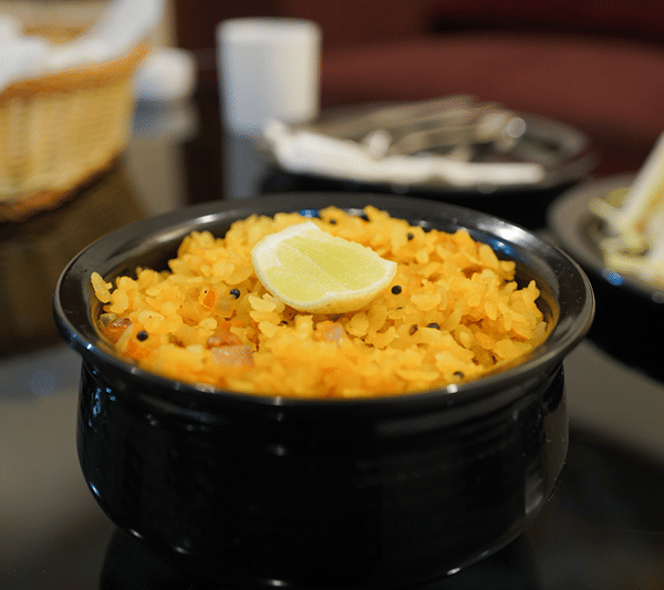 A bowl of lemon rice served at the table.