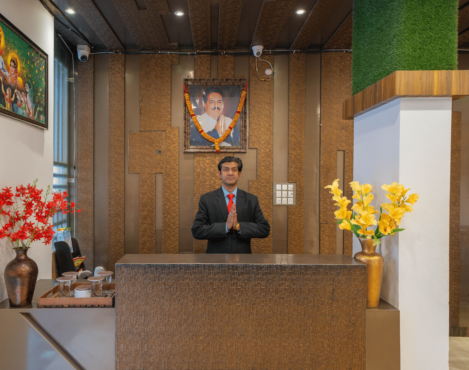 Hotel Reception Desk with an attendant standing behind it - Perfectstayz Premium at Har Ki Pauri Road (Ganga Heights)