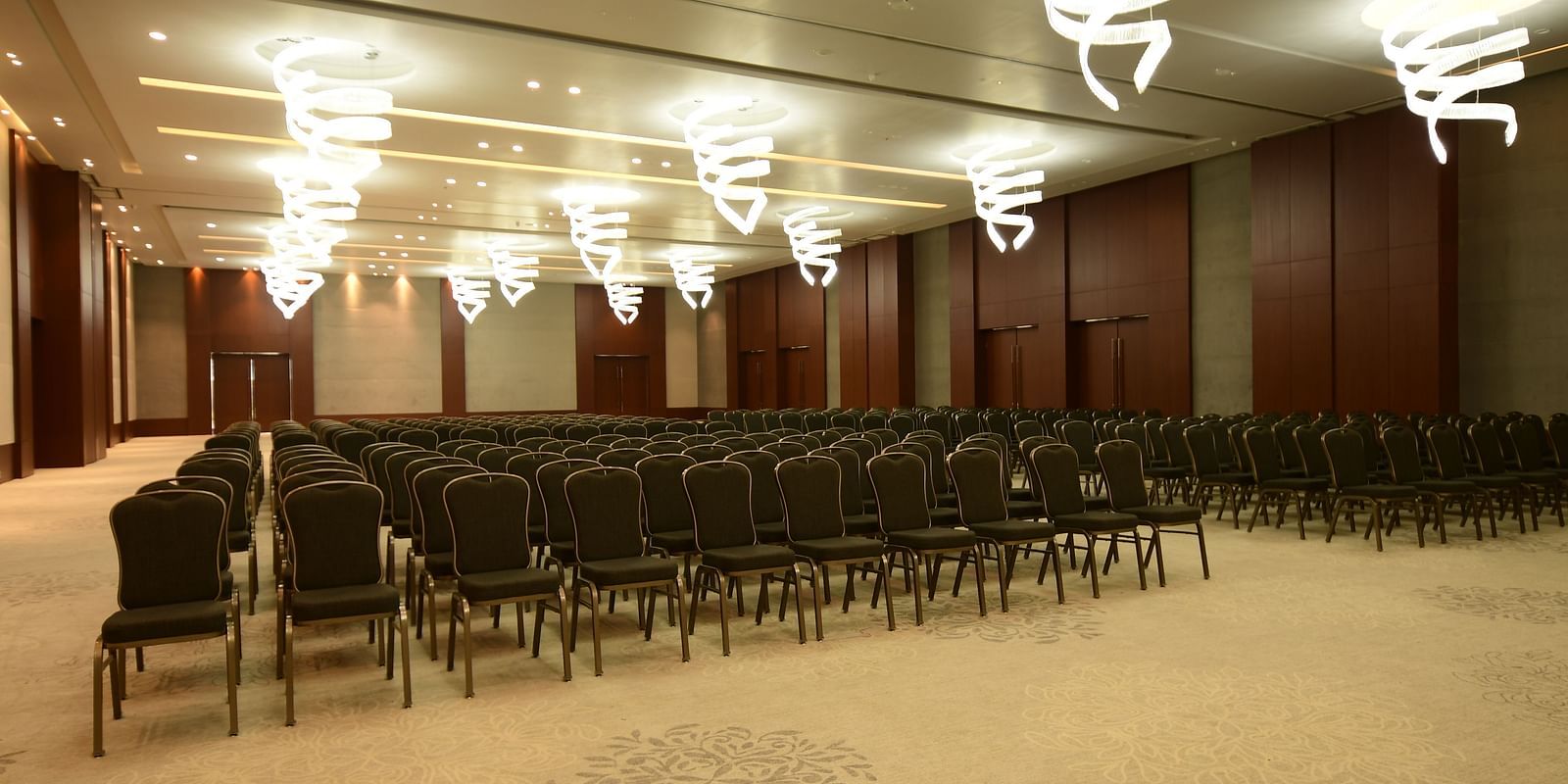 An event space with chairs neatly arranged on both sides