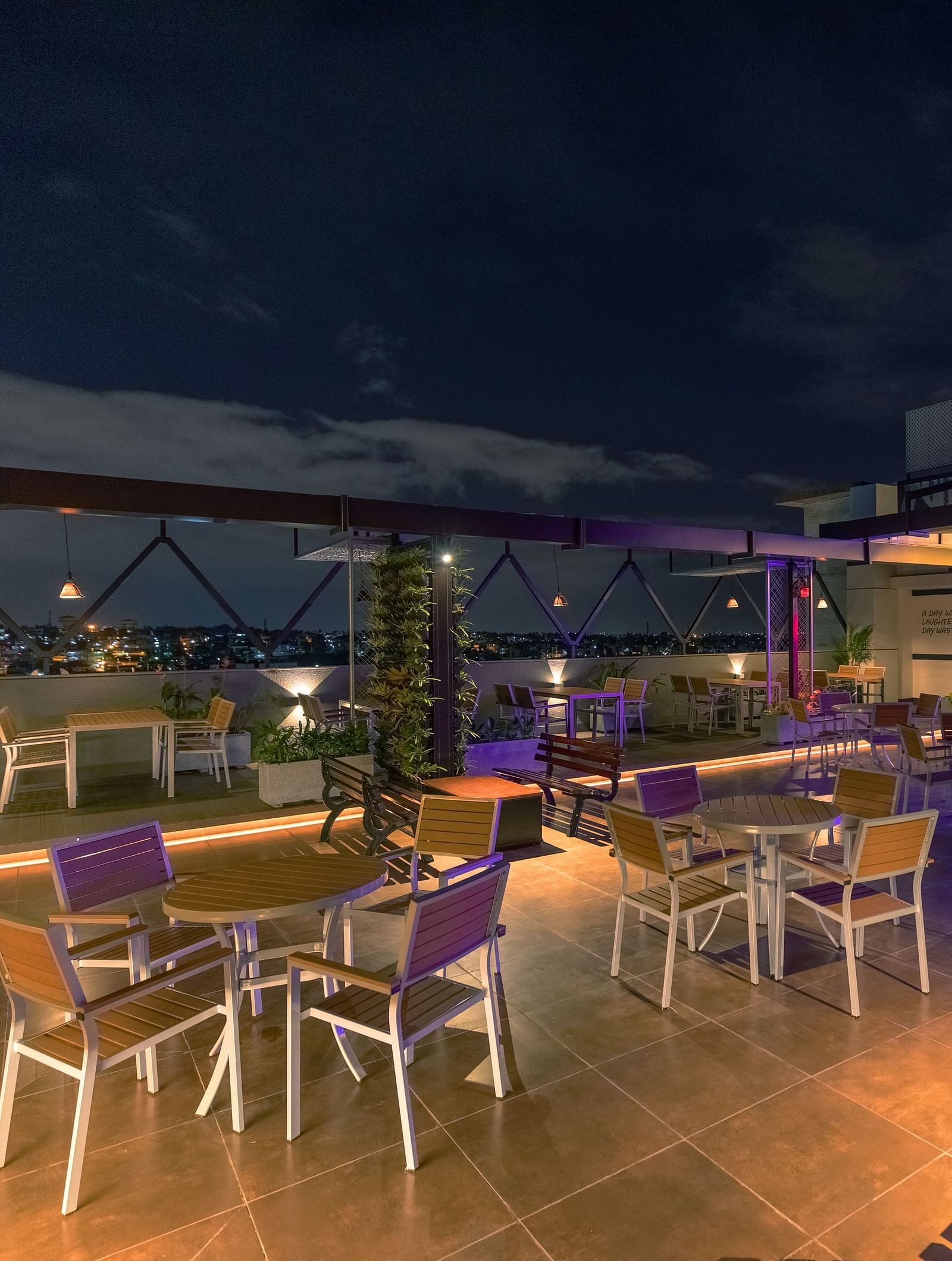 An image of a dining space with tables and chairs, complemented by an open roof at M Pro Palace.