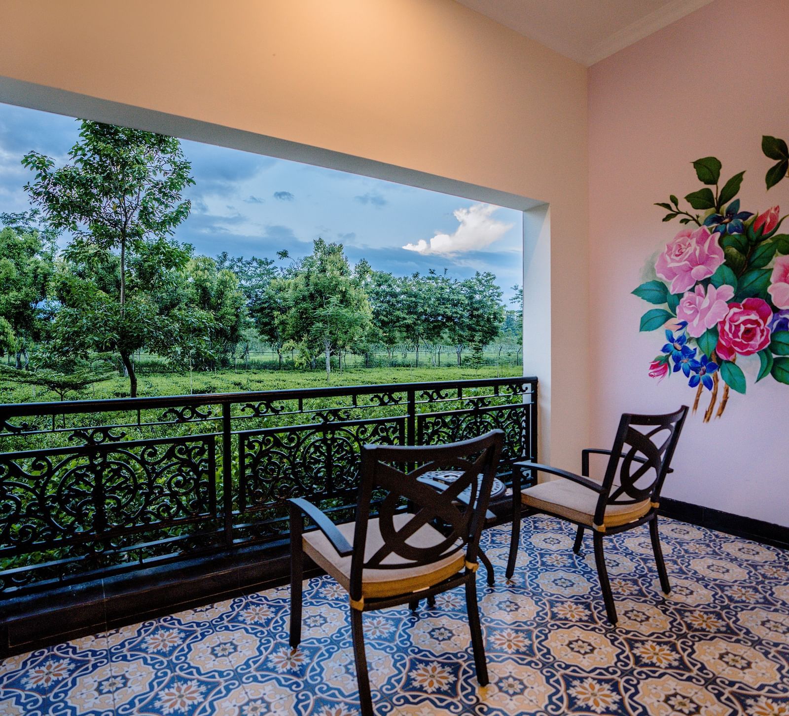 two chairs and a table kept in the balcony - Mayfair Tea Resort, Siliguri 1