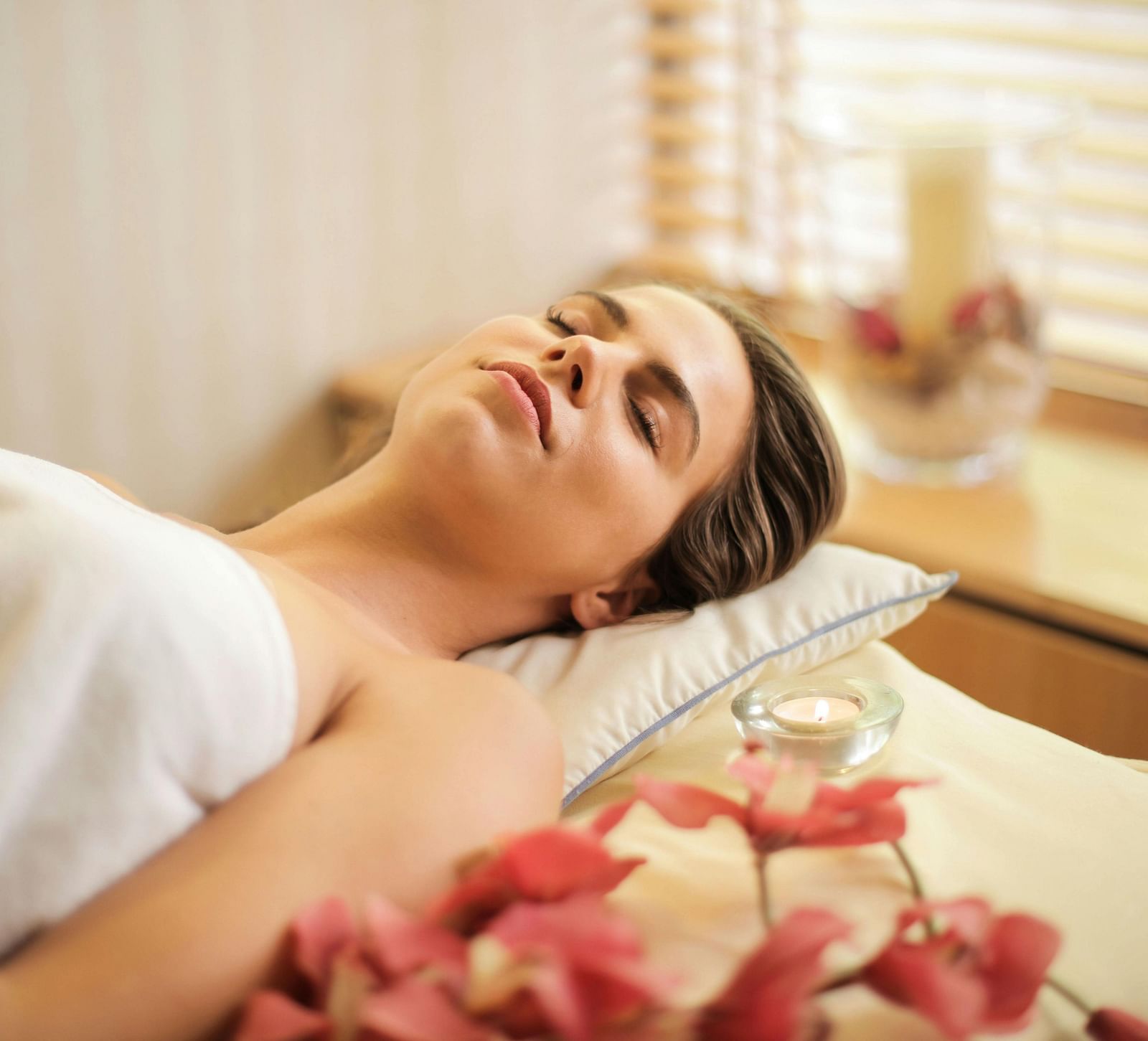 Image of a woman lying on a bed in a spa