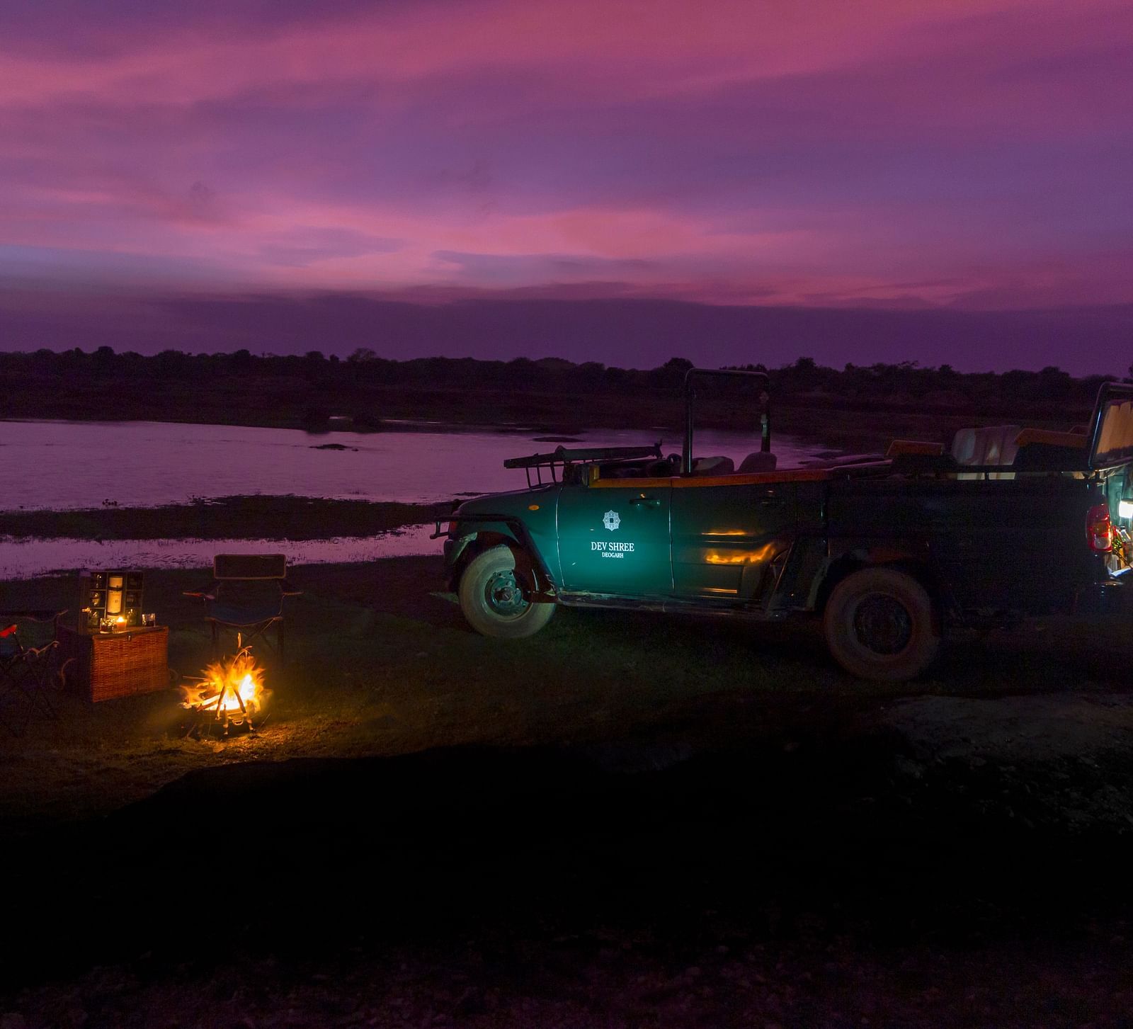 image showing the camping experience near a lake at Sunset at dev shree, deogarh