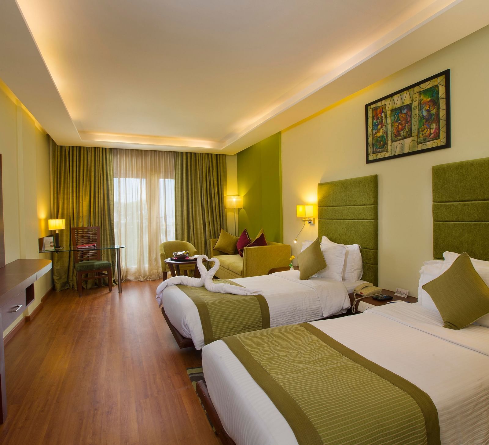 twin beds placed in Superior Room at Hotel Atithi - TGI Grand, Pondicherry