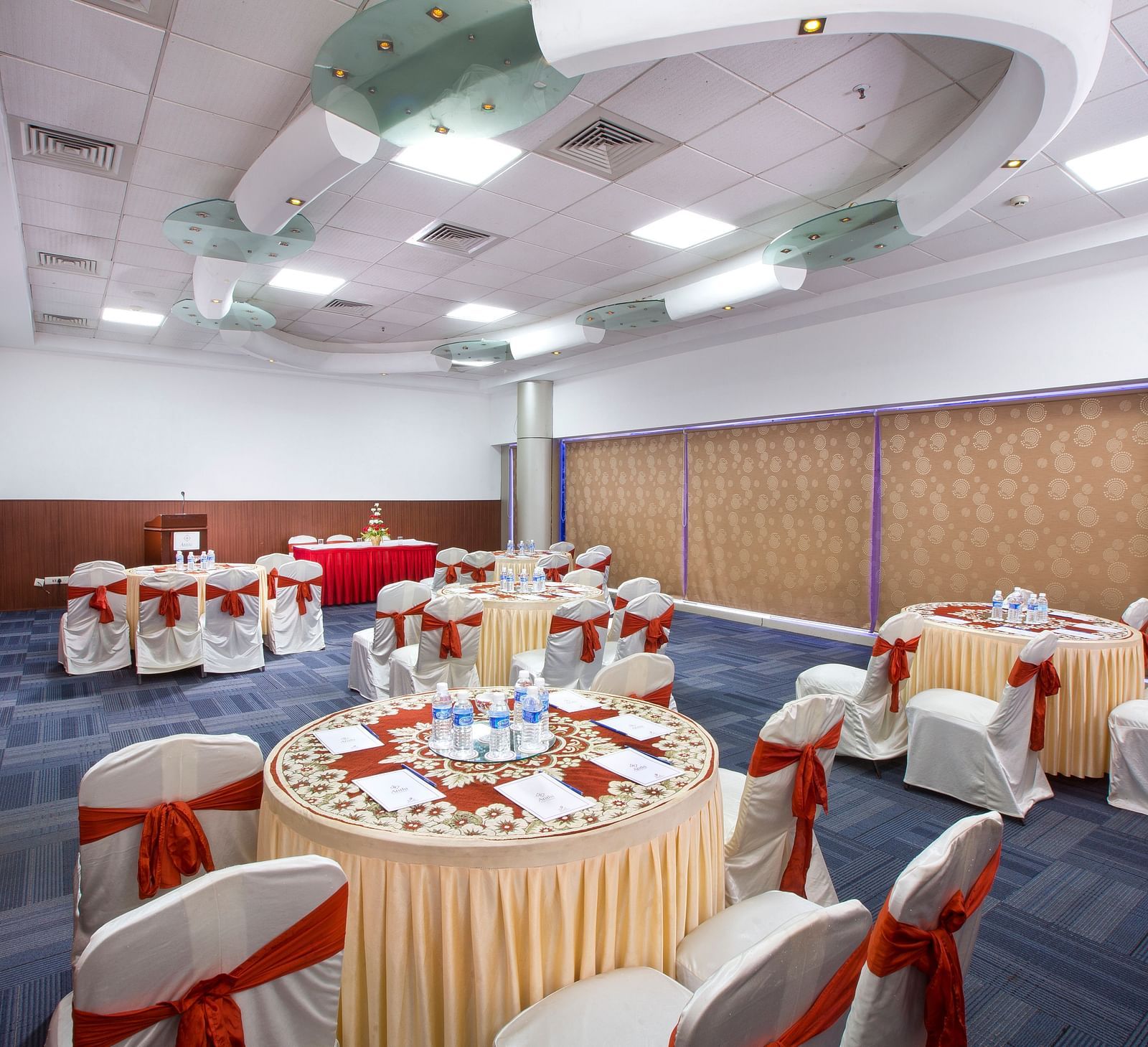 Centre Point at Hotel Atithi - TGI Grand, Pondicherry featuring round tables at chairs