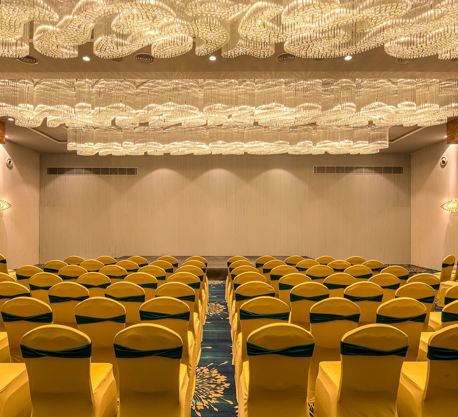 Yellow coloured chairs in the Sumo Anaika Banquet Hall at Le Foliage by TGI, Bangalore