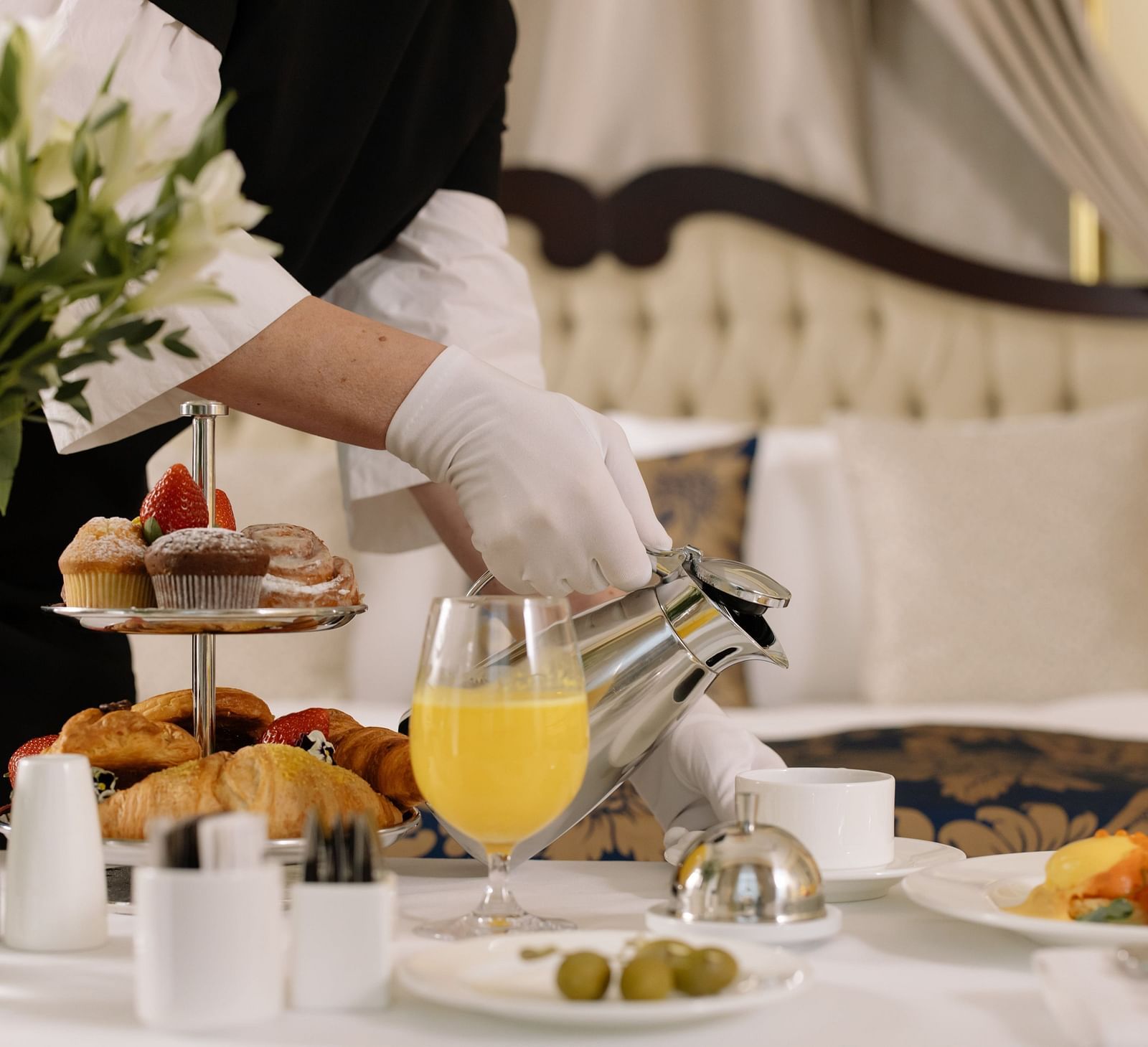 An image of a waiter serving food in a room