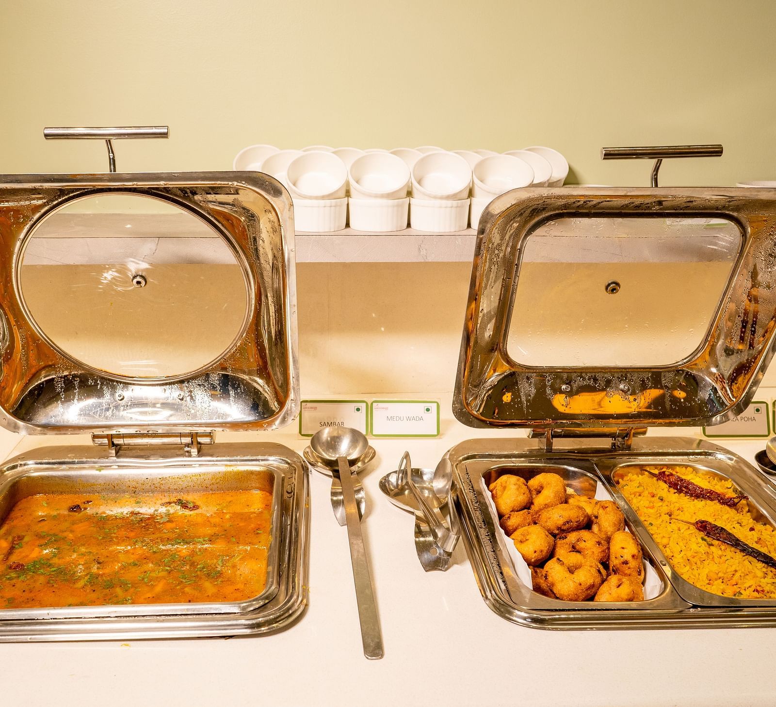 Chafing dishes with Indian cuisine on a buffet table - TGI Ameya Grand, Goa