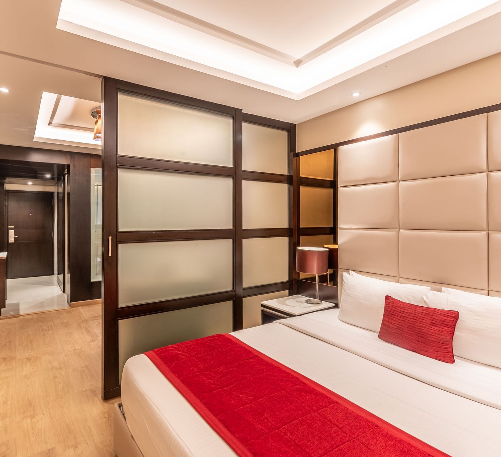 Fortuna suite view showing bed, wardrobe, and seating arrangement- TGI Grand Fortuna, Krishnagiri Main Road, Hosur