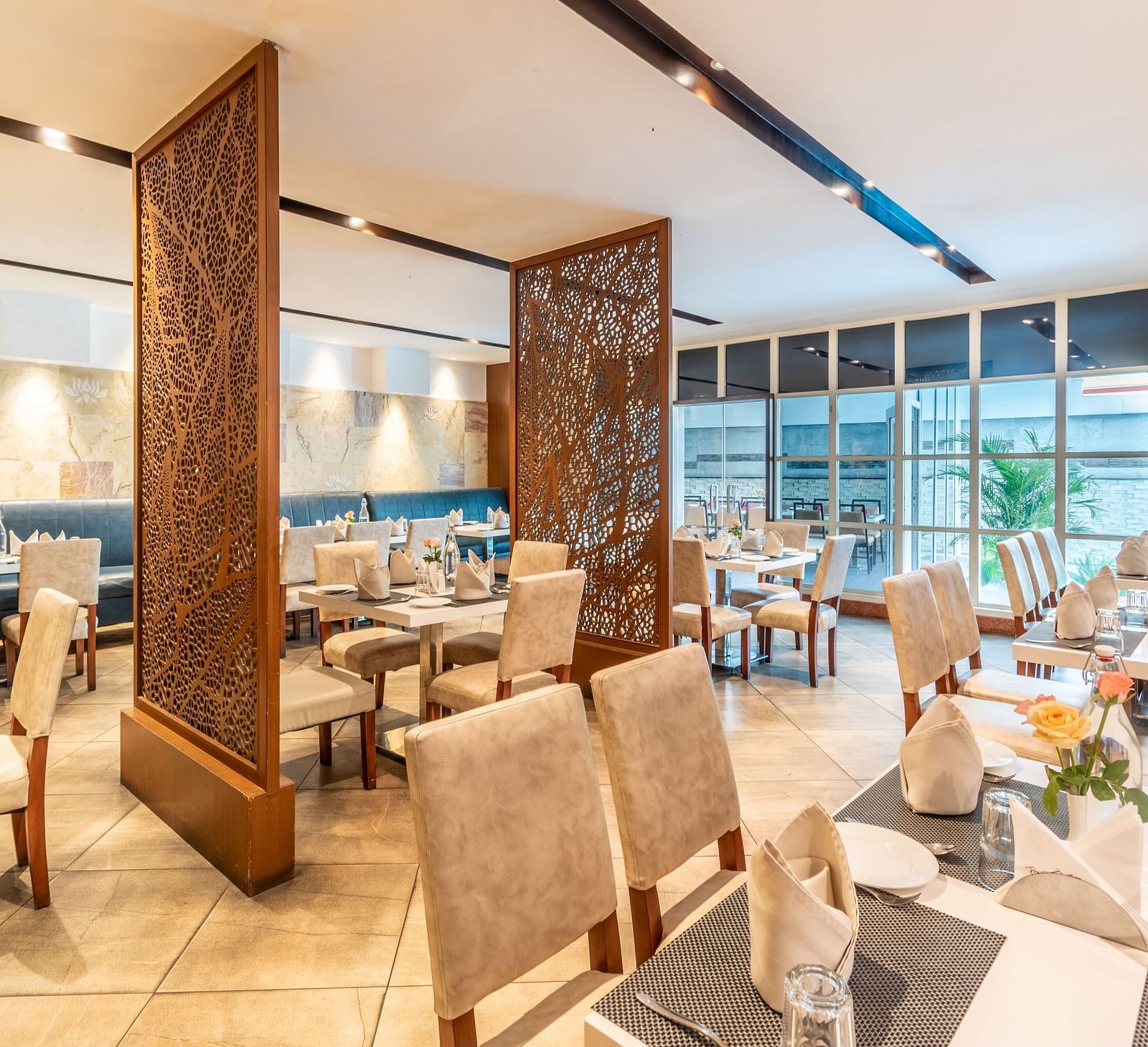 Elegant restaurant layout with decorative partitions and cosy seating- TGI Grand Fortuna, Krishnagiri Main Road, Hosur