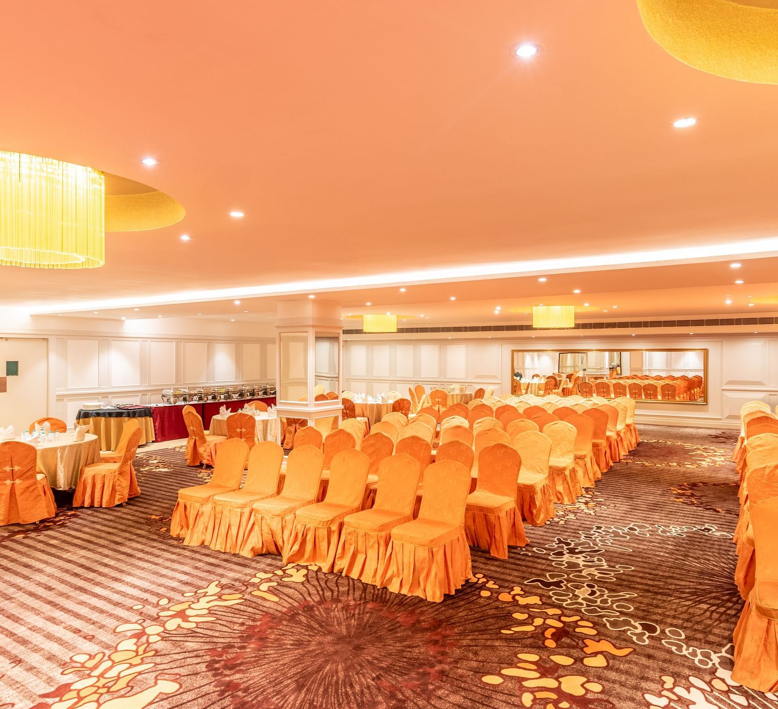 Spacious hall set up in classroom-style seating, ideal for training sessions or workshops