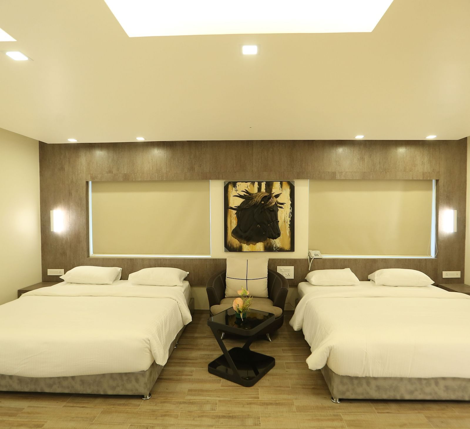 Club Suite with two double beds, and soft lighting.