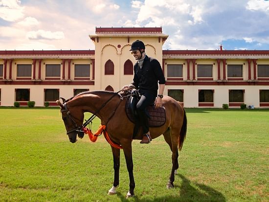 Ummed Hotels - A person sitting on a horse
