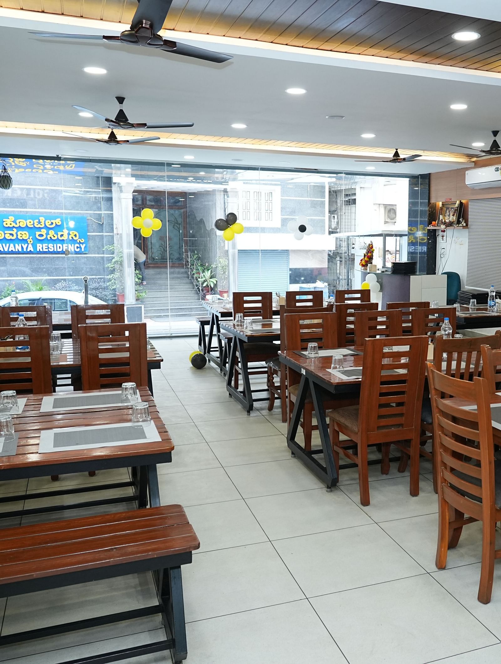 the restaurant at our hotel featuring the entrance made with huge glass windows - Hotel Grand Sigma