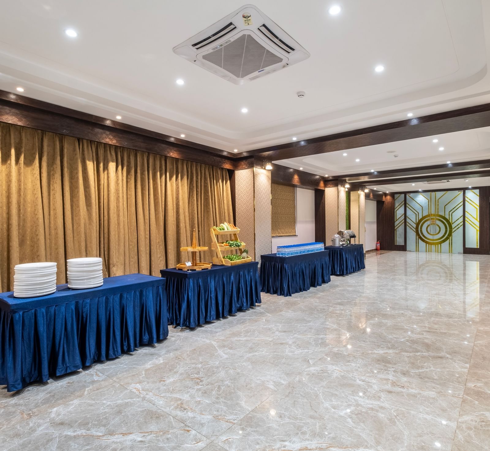 Spacious buffet counter at Monday Hotels Amalapuram Heights with modern decor.