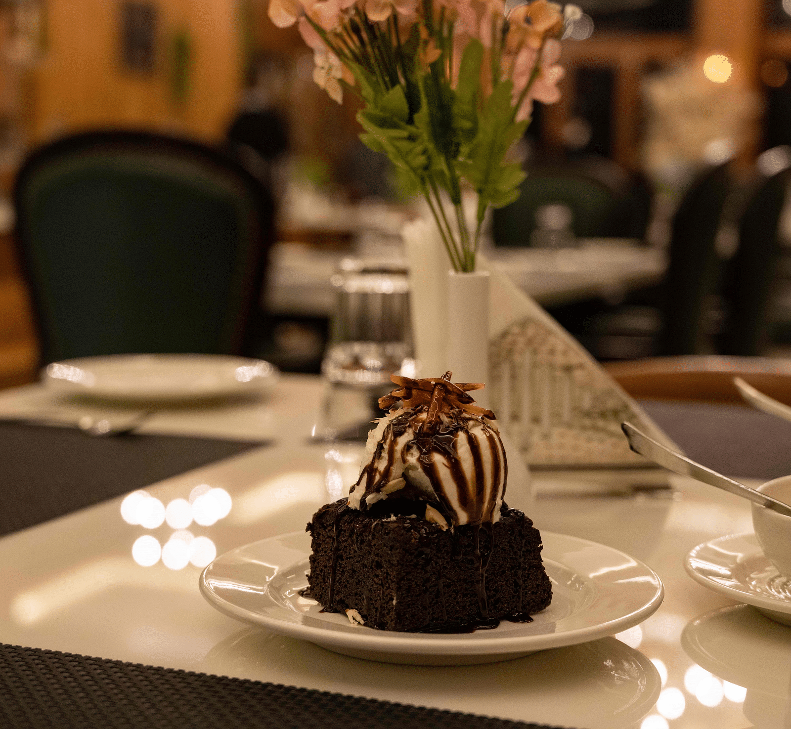 image of an ice cream scoop served with a brownie at the alpenrose restaurant- the tattva boutique resort