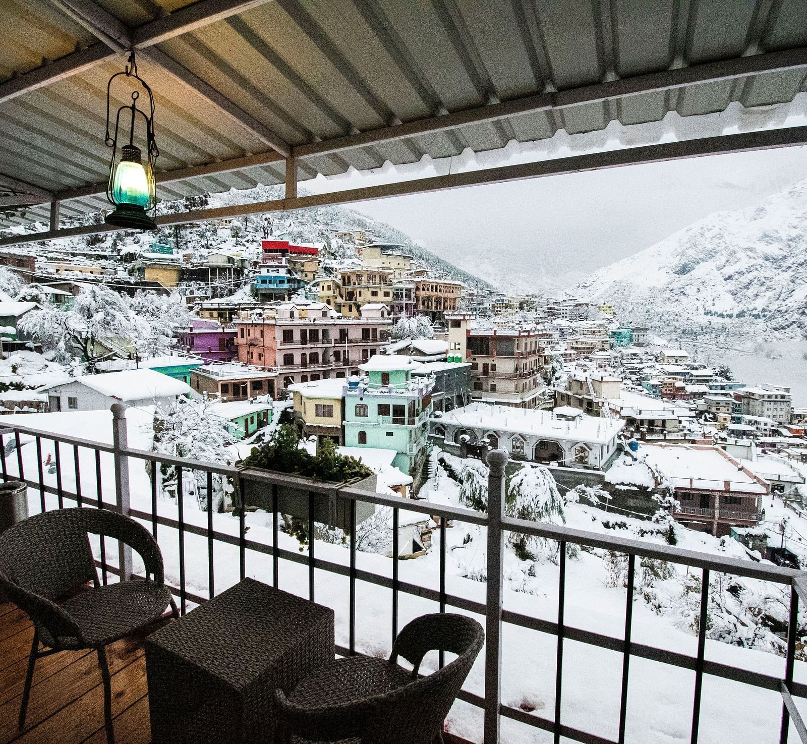 image of the city views on a snowy day with a think blanket of white snow covering everything - The Tattva, Joshimath