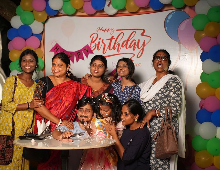 A birthday celebration at Rangamati Garden Resort, featuring guests cutting the cake and enjoying the festivities.